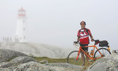 Peggy's Cove and cyclist