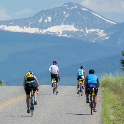 Cyclists heading towards mountains