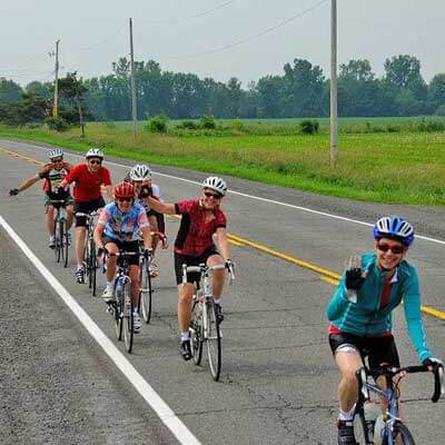 Group of cyclists riding on the road